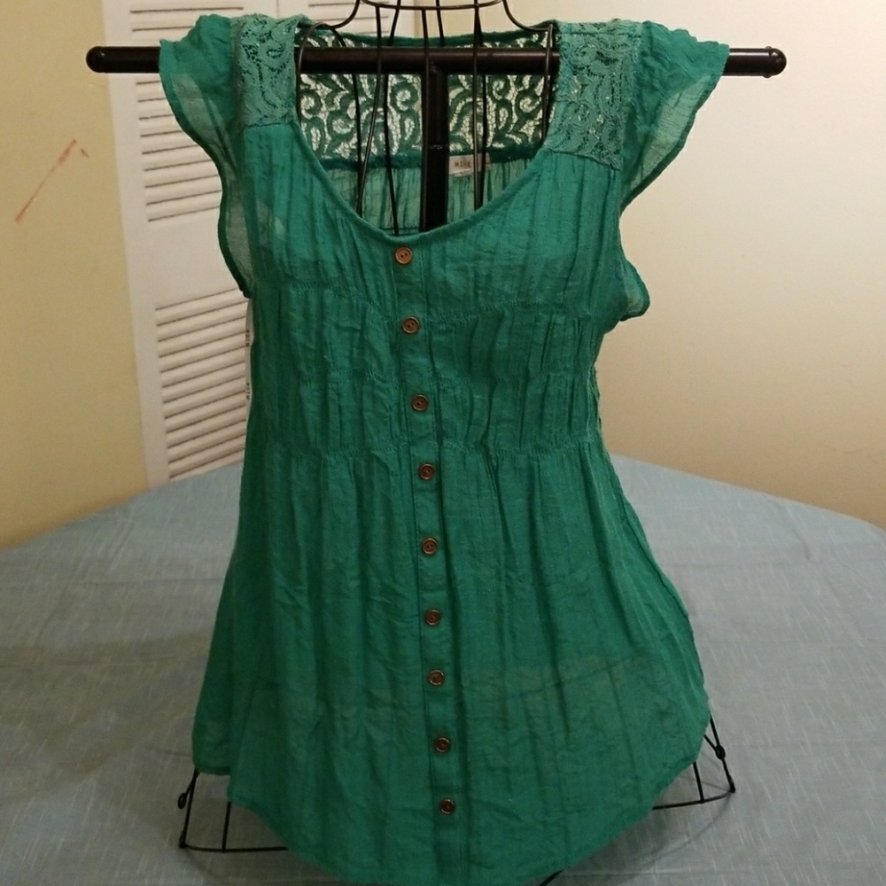 Green tank with lace and ruffle detailing